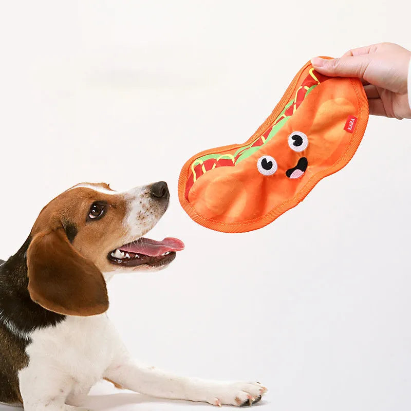 Four colourful dog toys shaped like hamburger, fries, hot dog and pizza with crinkle and squeak features