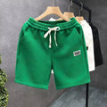 Men's solid colour polyester sports shorts in black, shown in an American casual style fit.