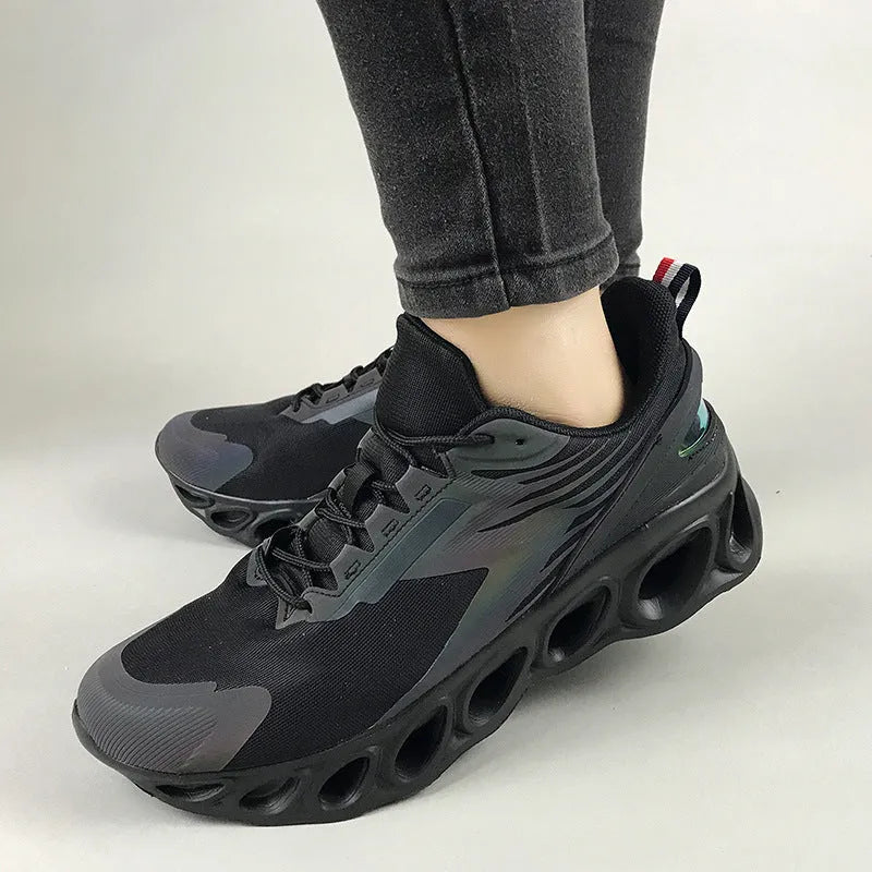 Men's low-top mesh sports shoes in black colour with white sole and lace-up front