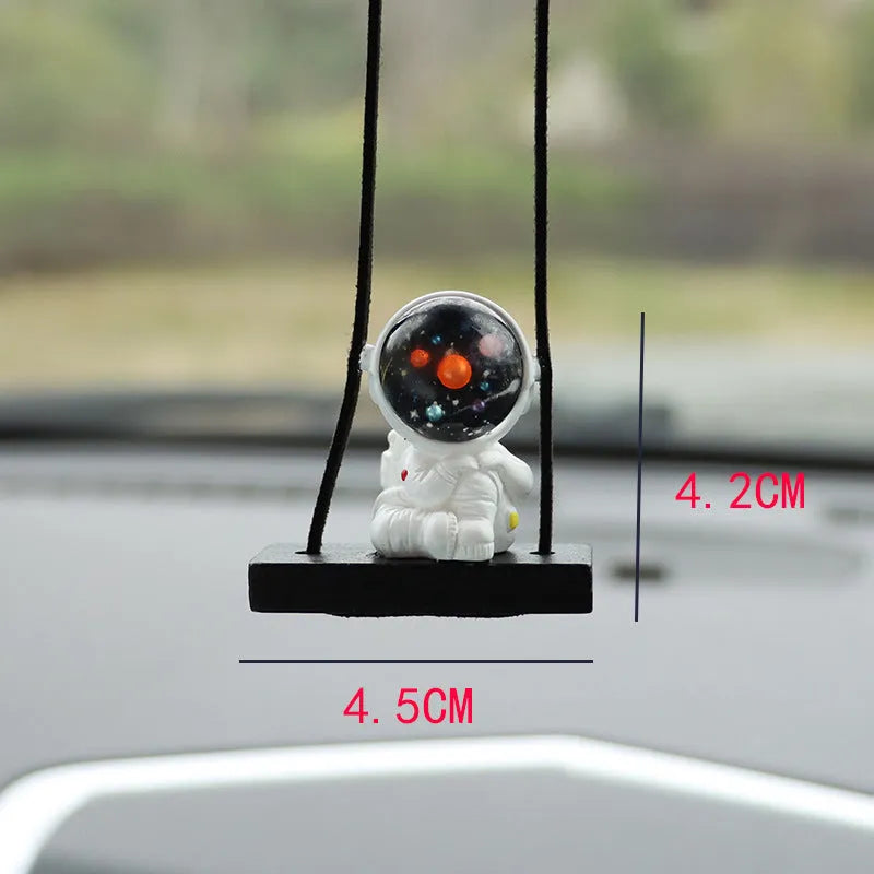 Resin astronaut car pendant with cartoon space explorer designs including telescope and radish variations