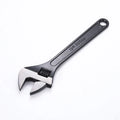 High carbon steel open-end adjustable wrench with black finish on a grey background.