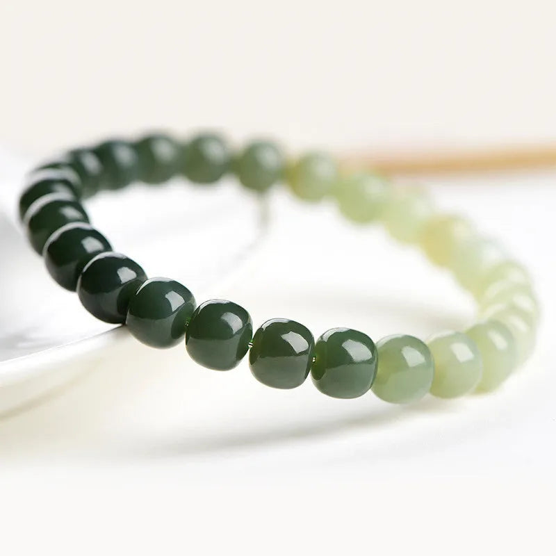 Natural Hetian Jade bracelet with water gradient colour and polished beads in unisex casual style.