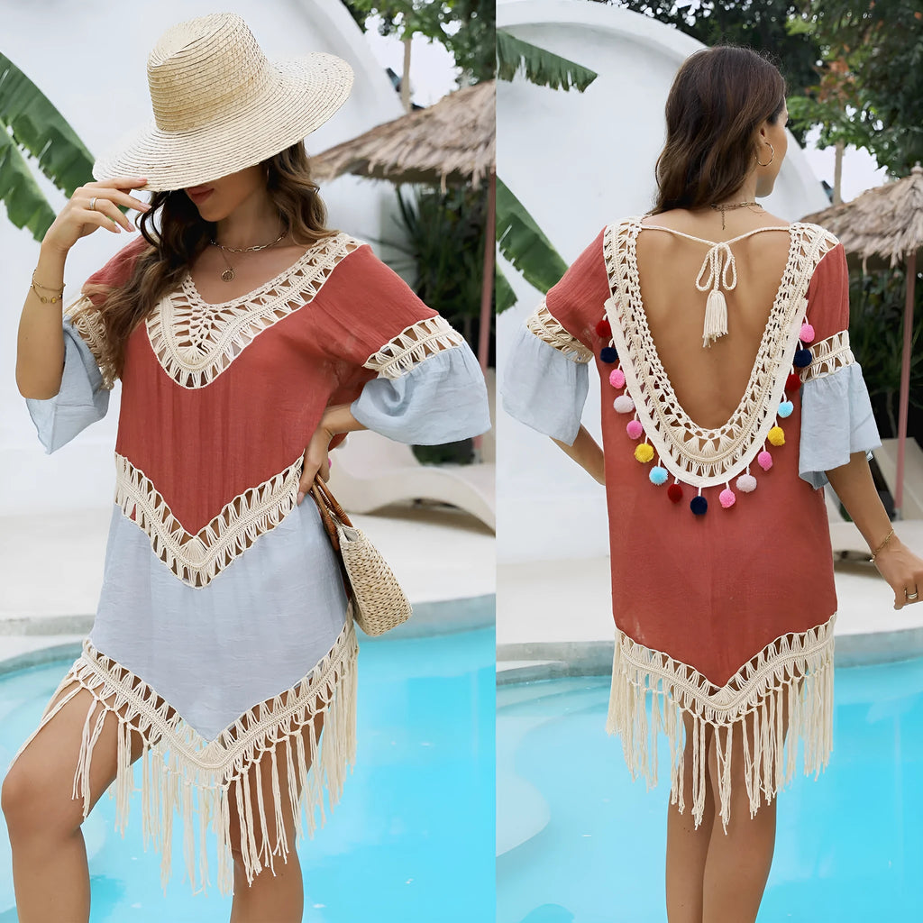 Orange floral pattern beach overskirt with hand crochet stitching and tassel detailing.