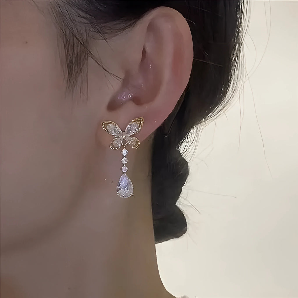 Bow stud earrings with electroplated platinum finish on zinc alloy