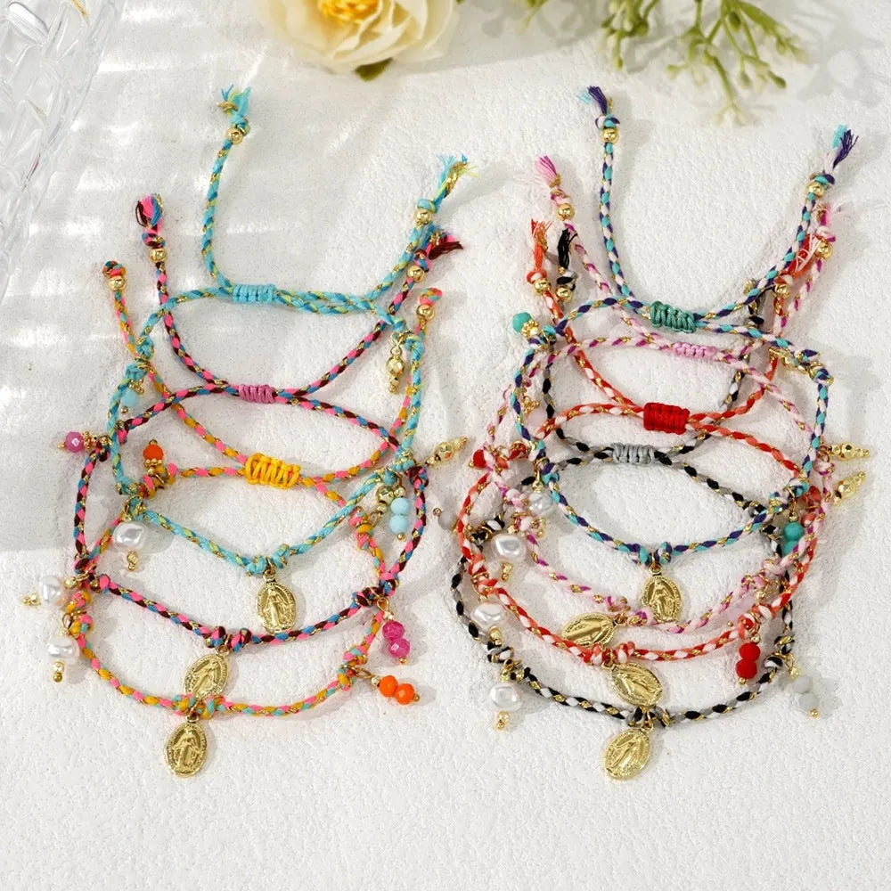 Close-up of a hand-woven ethnic bracelet for women made from colourful braided rope.