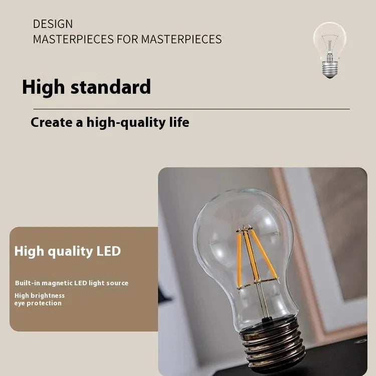 Iron art suspension bulb desktop night lamp on black wood-grain base