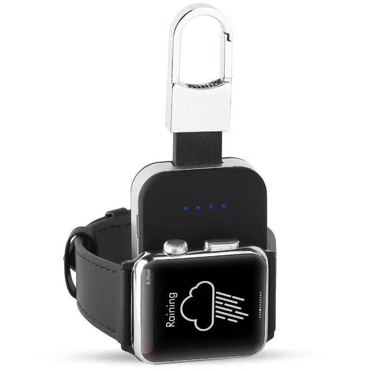 Black Apple Watch portable wireless charger keychain with keyring, shown next to an Apple Watch.