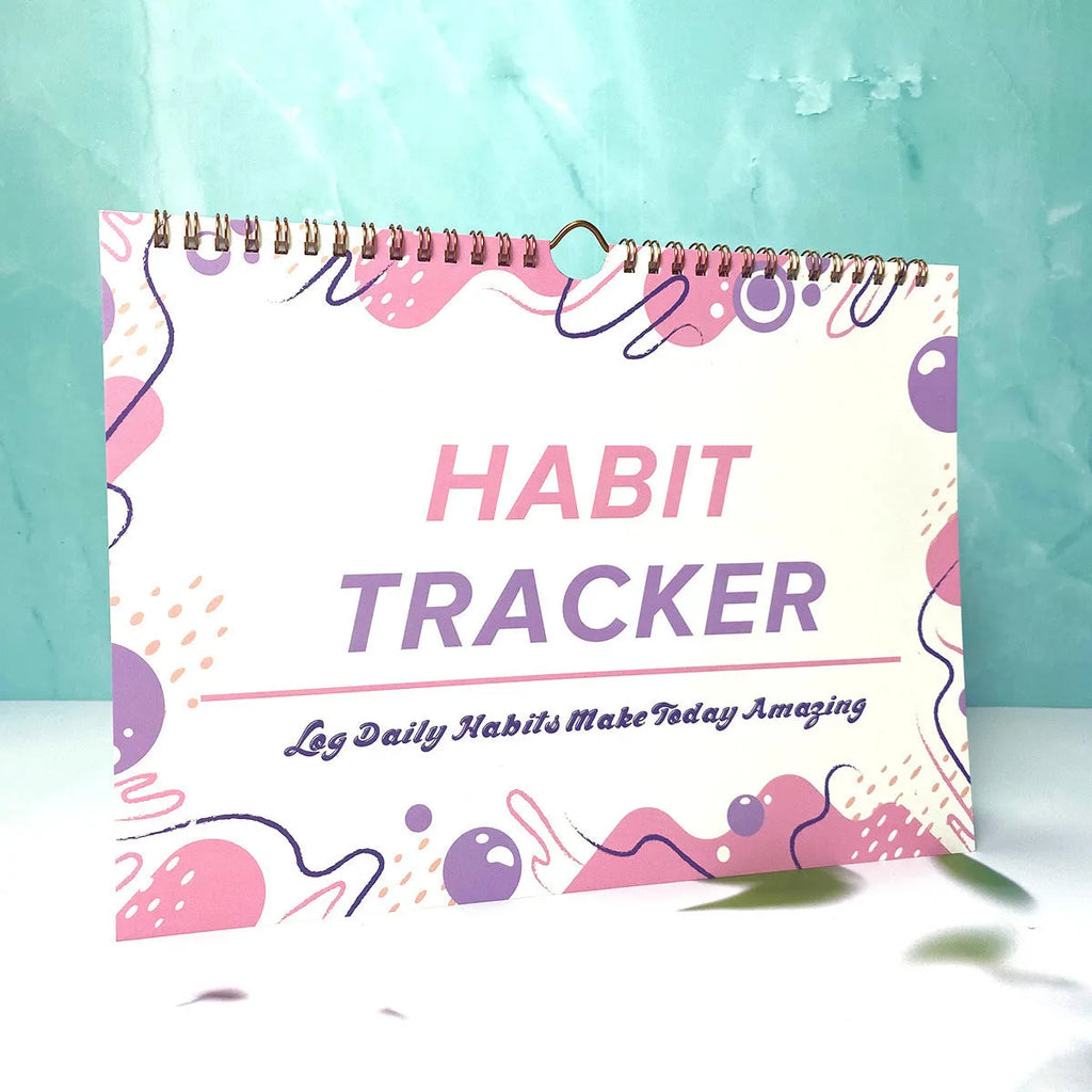 Habit tracking book with 12 pages measuring 21cm by 28cm in four colour options