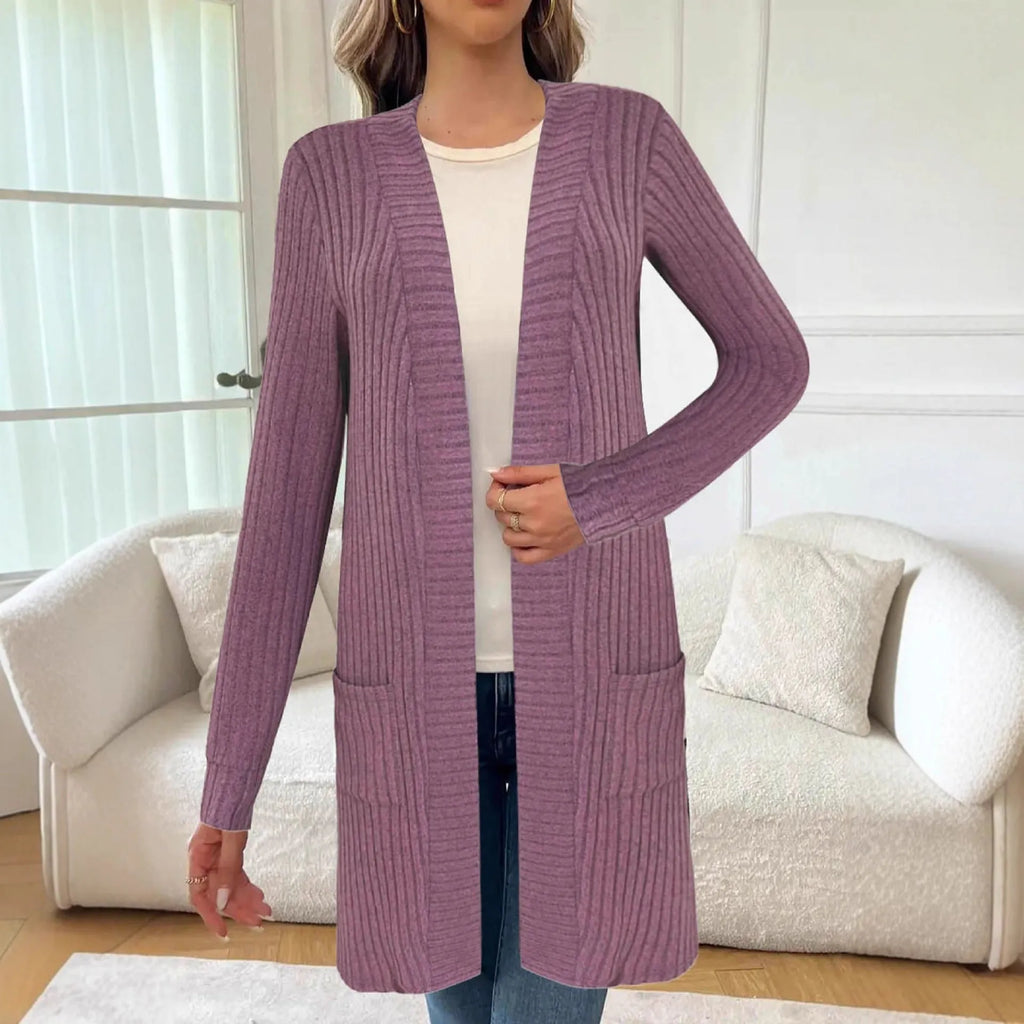 Loose fit grey knitted cardigan jacket with long sleeves and patch pockets on a hanger.