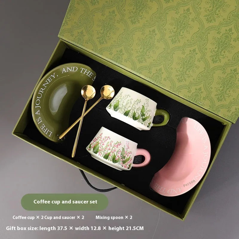 Ceramic coffee cup and saucer set for two people in Campanula design, with two mugs, two saucers, and two spoons.