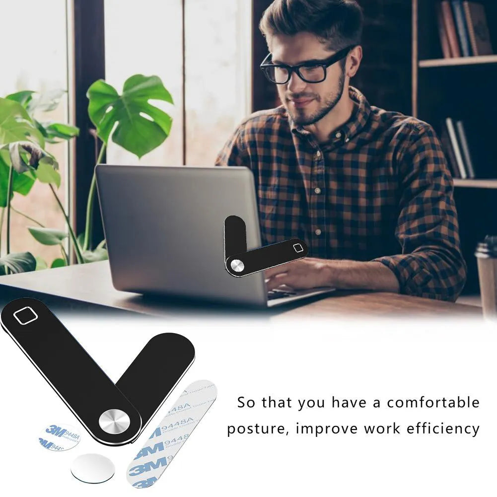 Black aluminium laptop phone holder with magnetic mount attached to computer monitor