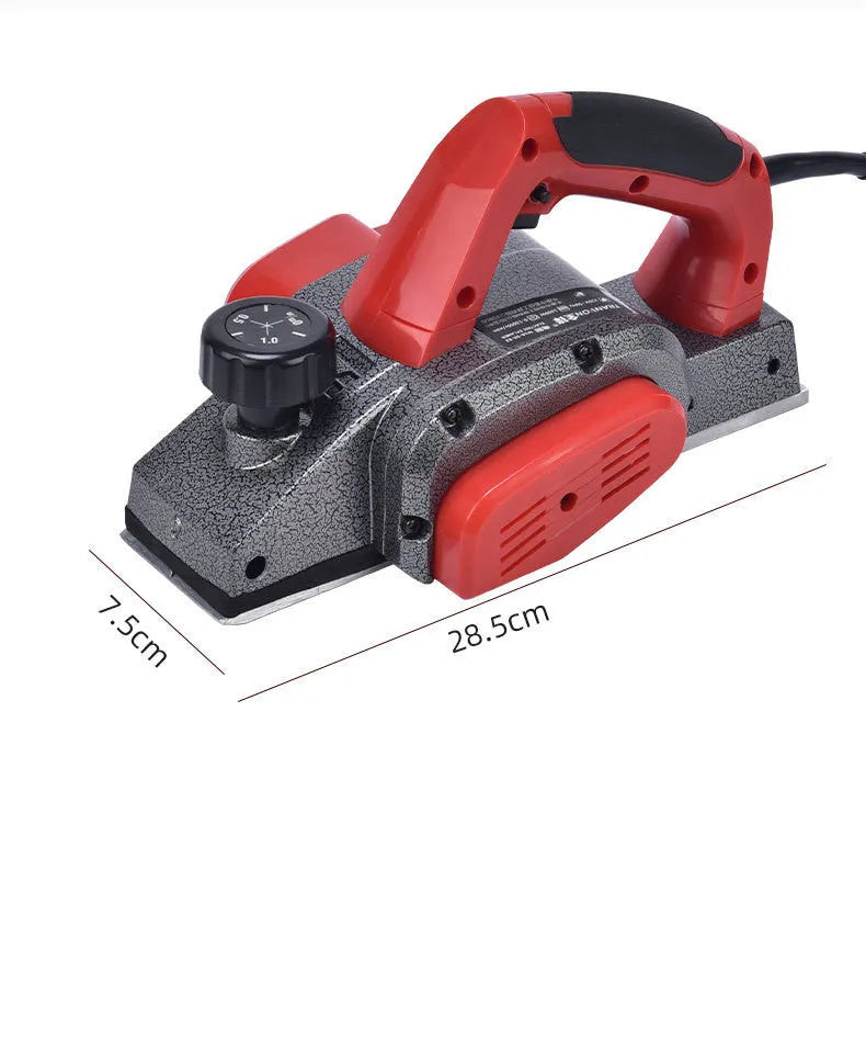 Red aluminium shell electric wood planer with 82mm cutting width on workbench