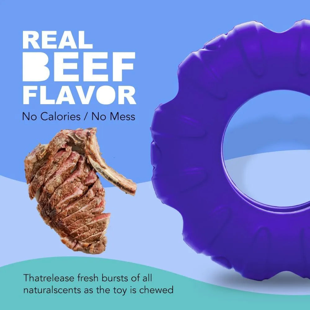 Blue tyre-shaped dog chew toy with oval openings for treat dispensing