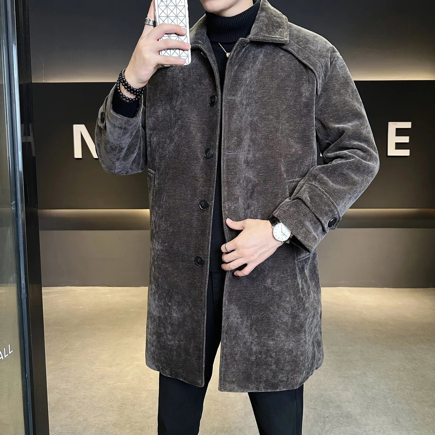 Long brown cotton wool blend jacket with thickened windproof construction, regular fit, and polyester lining, shown front view.