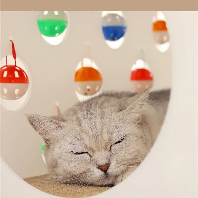 Plastic integrated cat scratch board with attached nest, tunnel, and bell ball toy