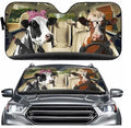 Telescopic aluminium foil car sun shield extended across a vehicle windscreen