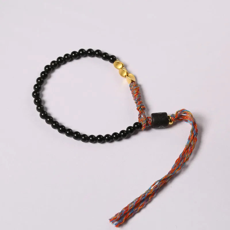 Hand-woven obsidian carrying strap showing 4mm width and adjustable length for phones, keys, or cameras