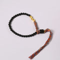 Hand-woven obsidian carrying strap showing 4mm width and adjustable length for phones, keys, or cameras