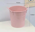 Round metal pen holder in choice of colours with optional decorative sticker patches on a desk.
