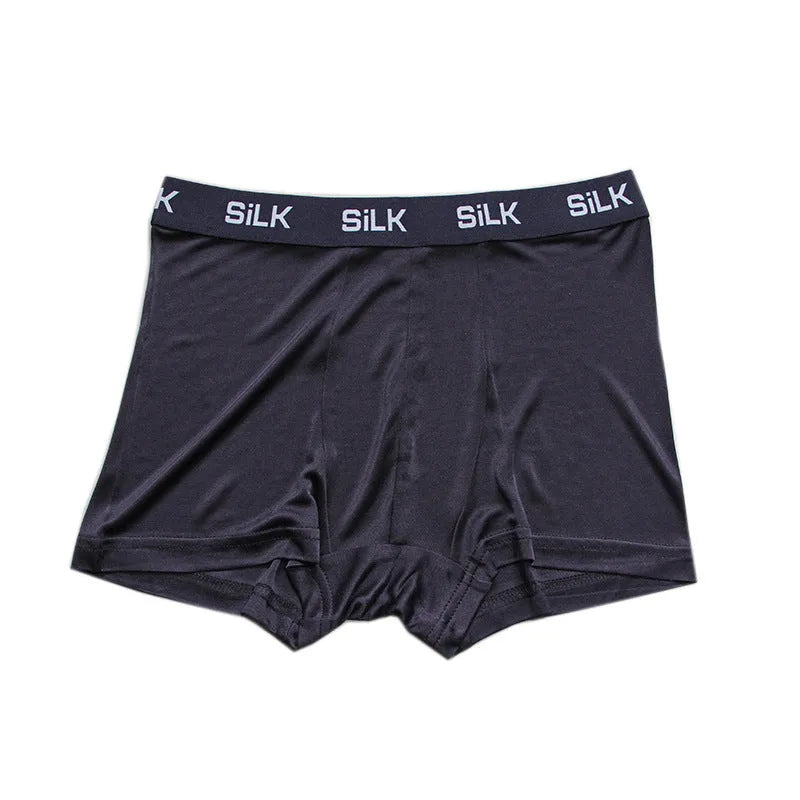 Men's loose-fit silk shorts in navy blue, shown laid flat.