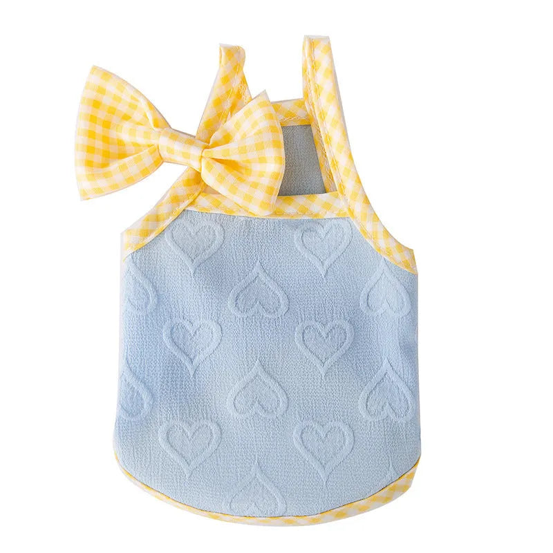 Small dog wearing heart texture vest with bow suspenders in Bondi Blue