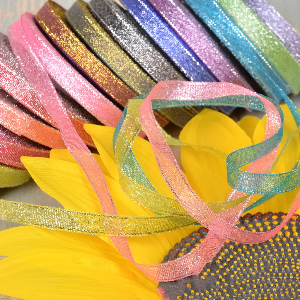 A roll of colourful green onion pattern polyester ribbon with metallic wire highlights, shown at 3-points width.