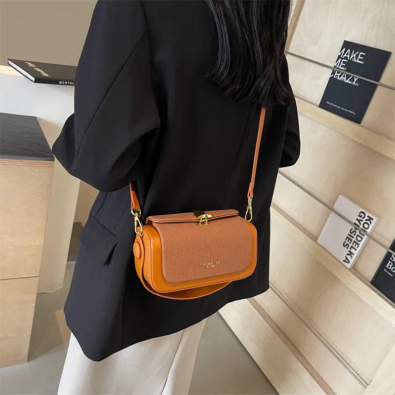 Women's black PU leather messenger bag with horizontal square shape and single shoulder strap