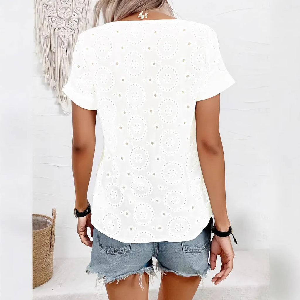 White women's V-neck T-shirt with hollow out pattern detail and loose fit silhouette