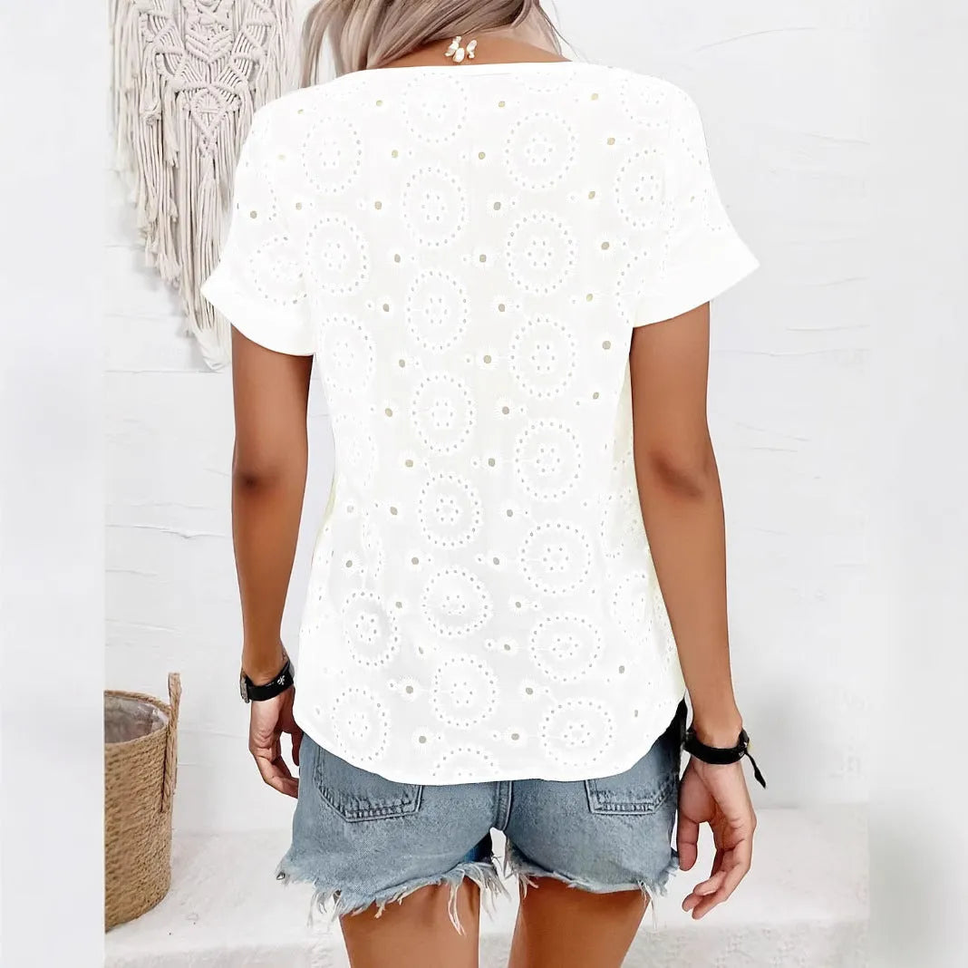 White women's V-neck T-shirt with hollow out pattern detail and loose fit silhouette