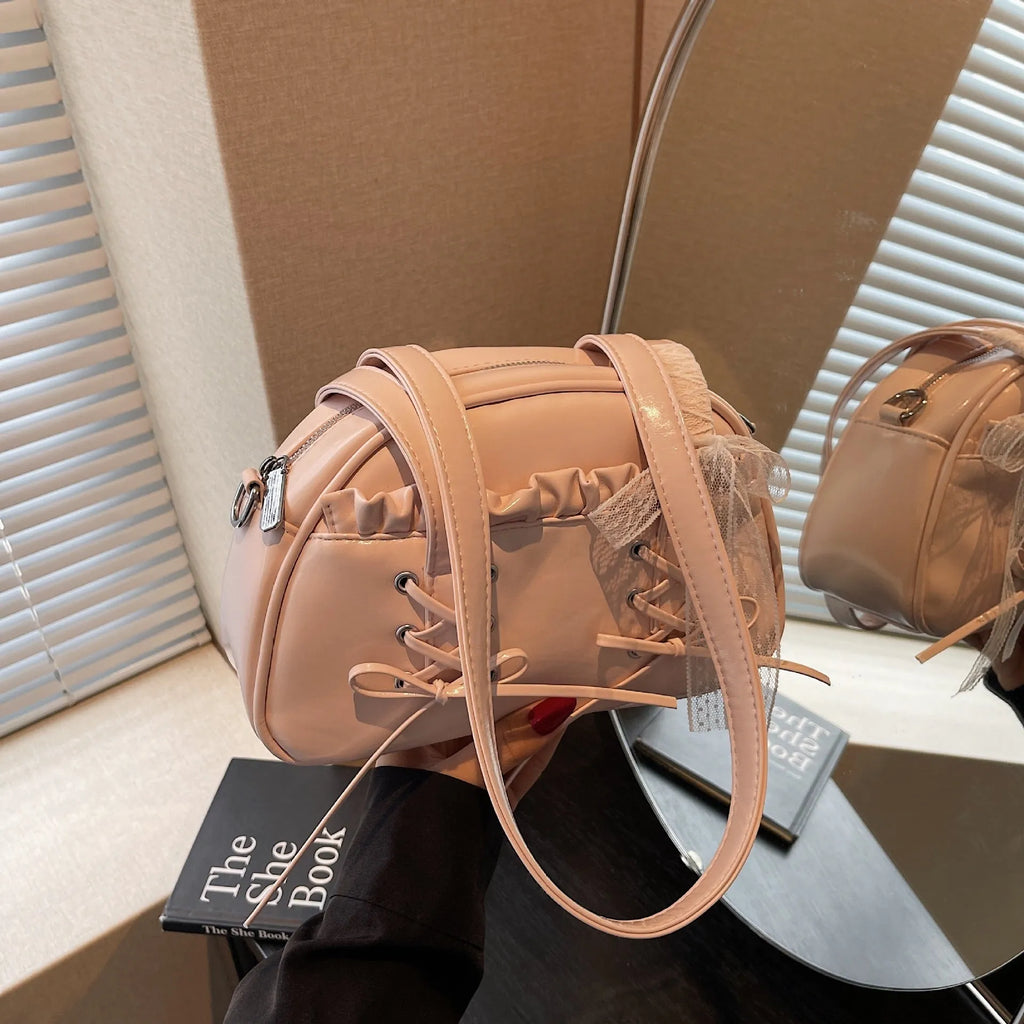 PU leather ladies shoulder handbag with phone compartment in milky white colour showing decorative stitching