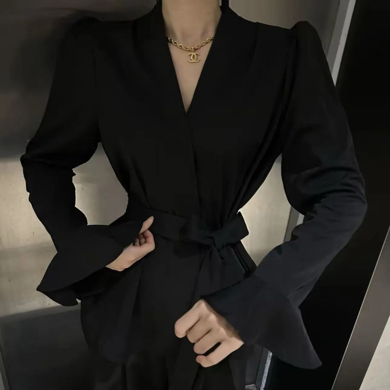 Women's French-style shirt with irregular collar and tied front in polyester fabric with bell sleeves