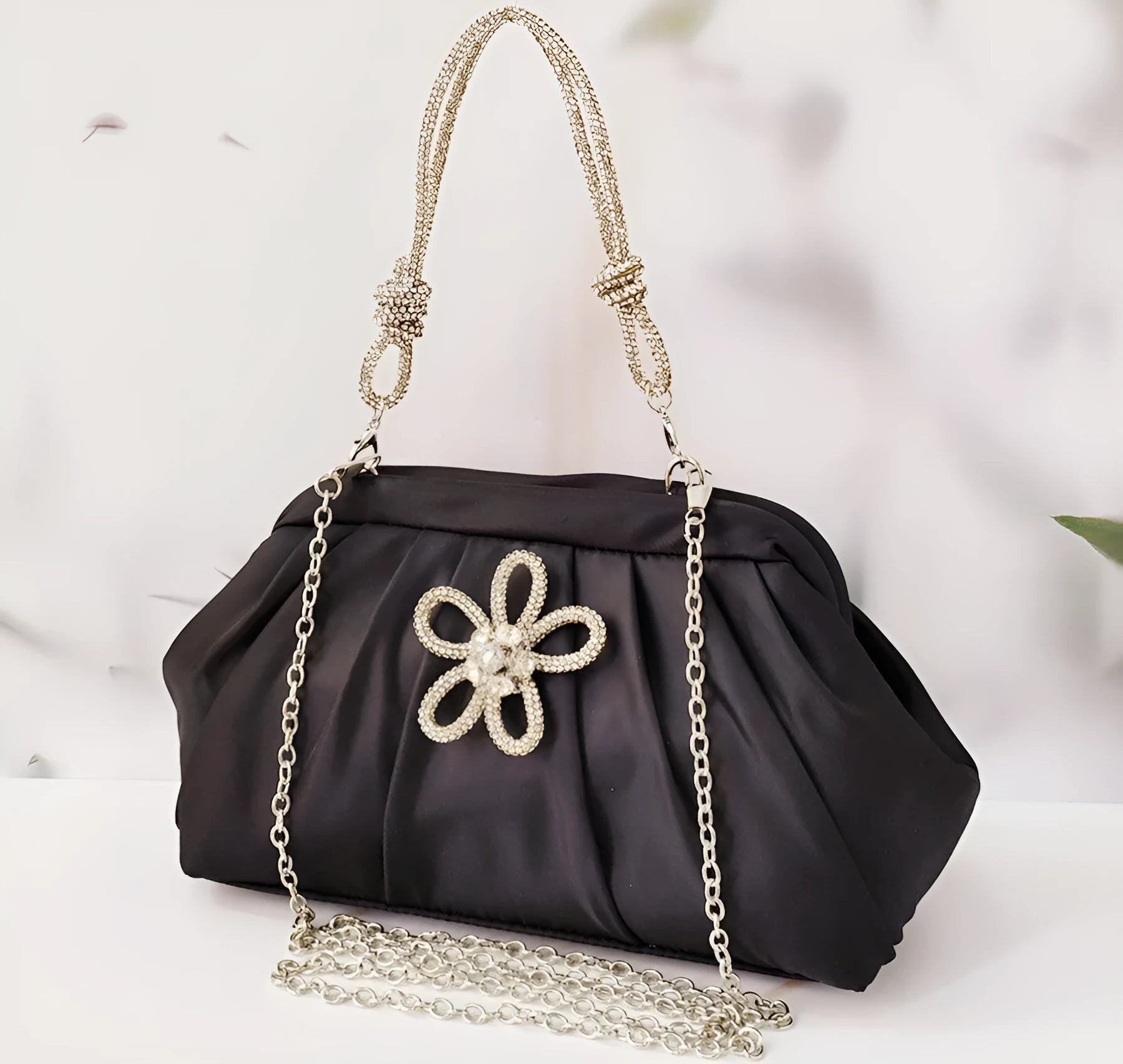 Women's soft polyester shoulder messenger bag in shell shape with diamond folds and chain detail.