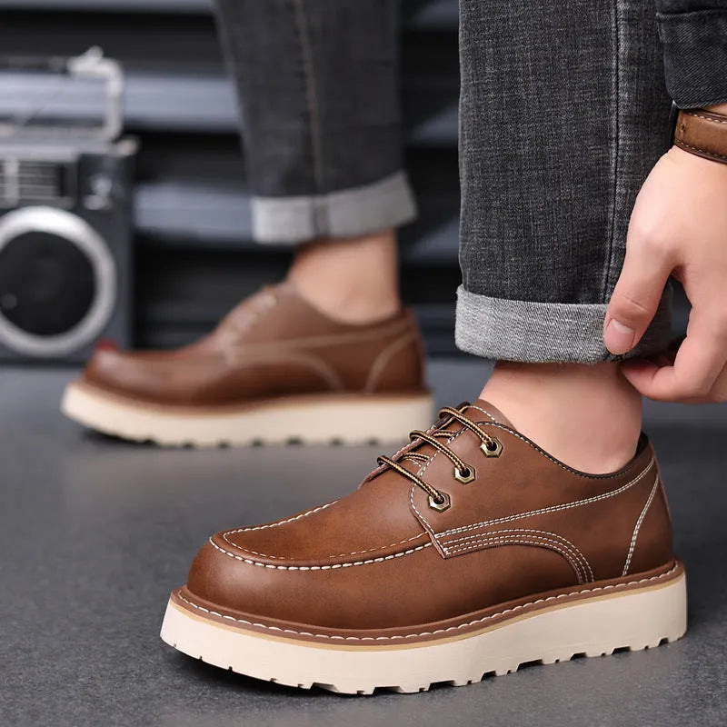 Men's black retro low-top Martin boots with a round toe and mid-height heel on a rubber sole.