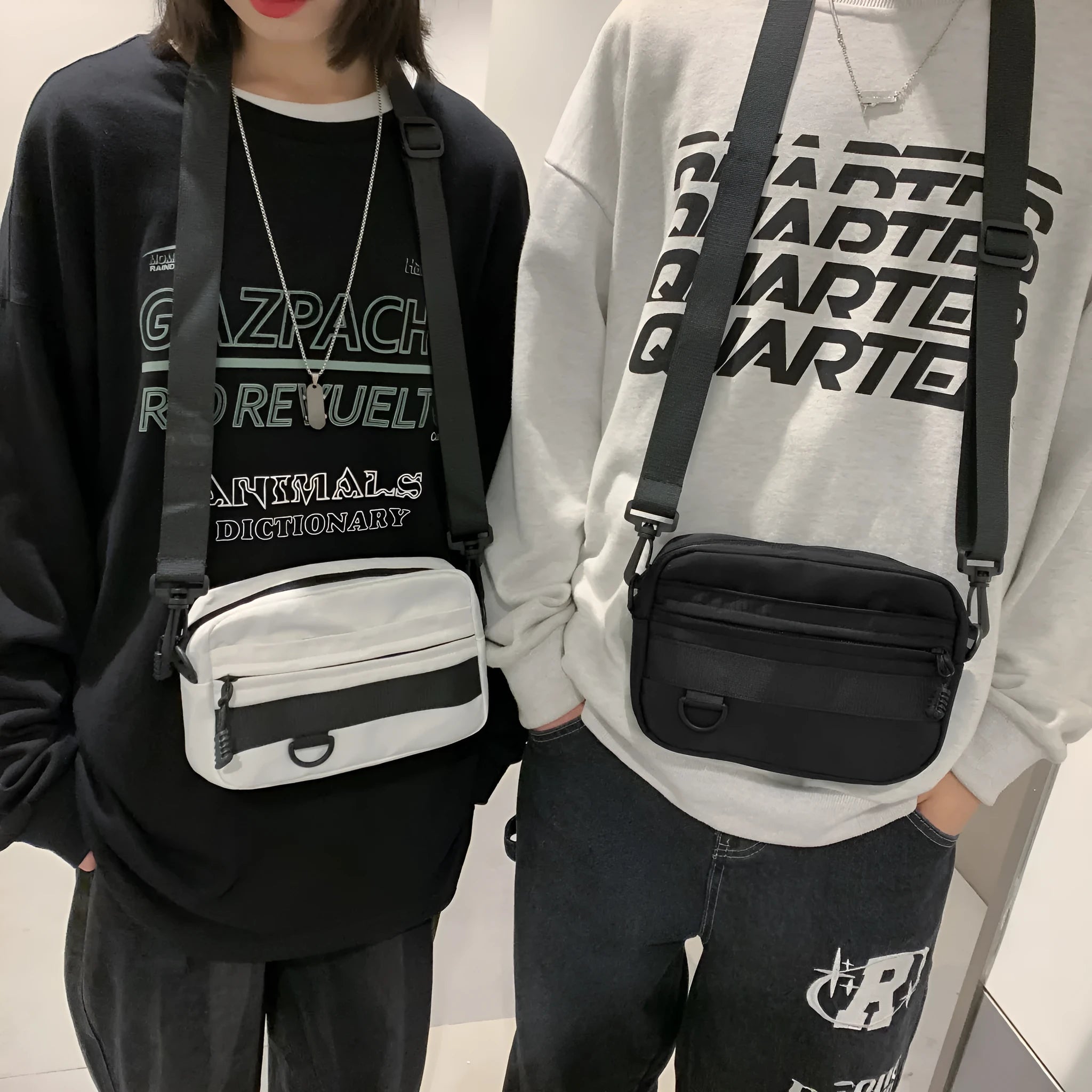 Men's street style nylon messenger bag in black with crossbody strap and sewing thread detailing