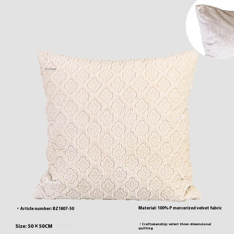 Brown gold antique-style quilted square cushion pillow and matching lumbar pillow on a sofa.