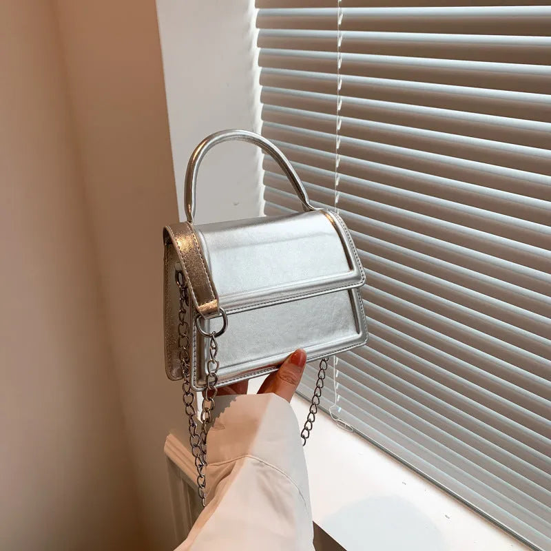 Retro square-shaped PU crossbody bag in a choice of six colours on a model.