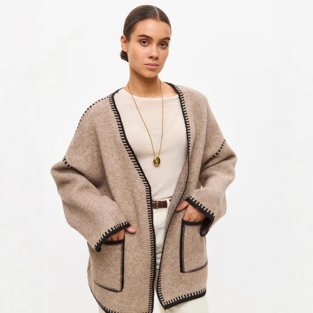Loose lace-up front knitted cardigan in camel colour, showing mid-length fit and long sleeves.