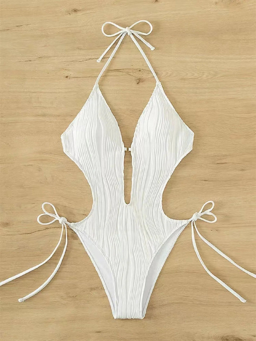 Women's black lace-up triangle bikini swimsuit on white background