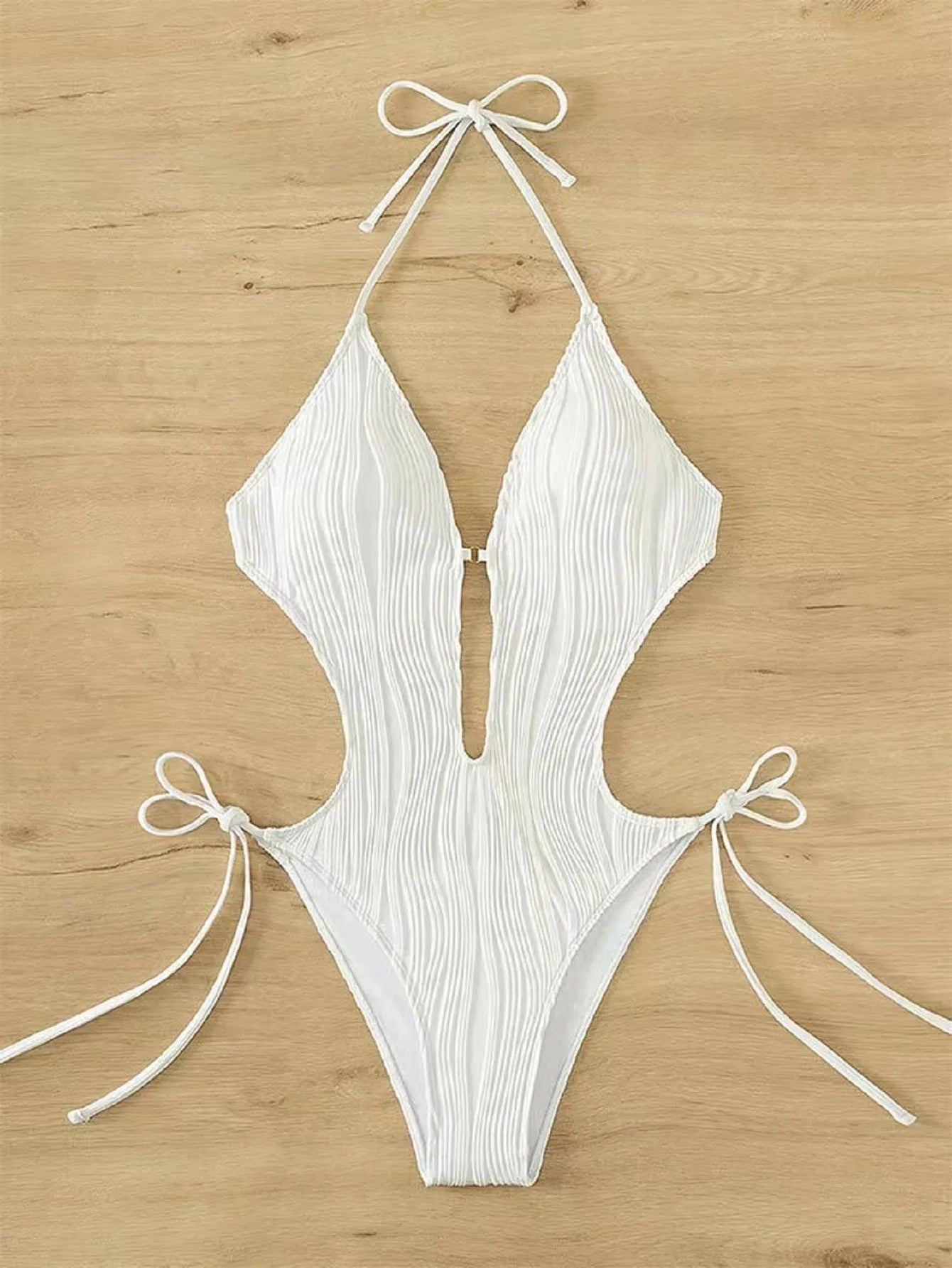 Women's black lace-up triangle bikini swimsuit on white background
