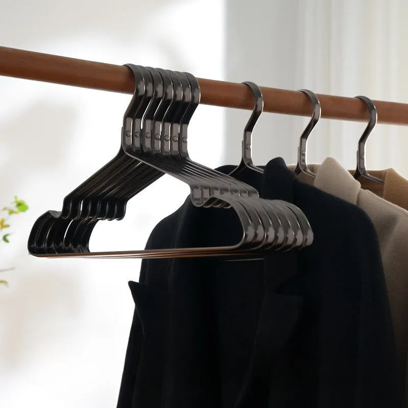 Elegant black modern simple clothes hanger for non-slip anti-rust garment organisation.