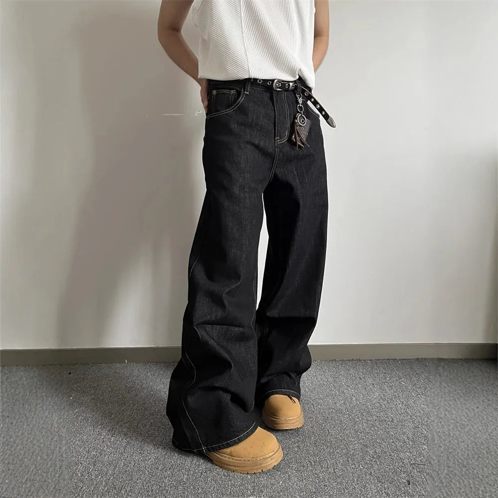 Black retro-style loose wide-leg straight-leg jeans on a hanger, showing mid-waist and zip fly.