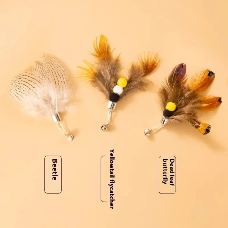 Three steel wire cat toy replacement heads shaped like small flying insects in assorted colours.