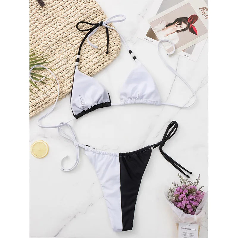 Women's lace-up triangle cup bikini set in black and white nylon polyester