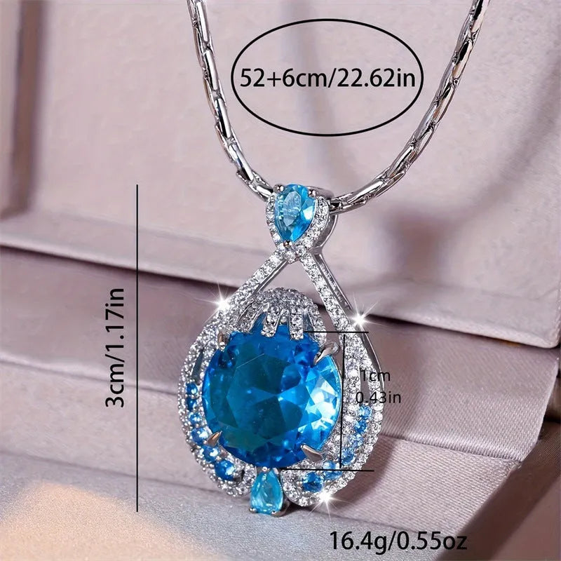 Blue geometric pendant necklace with fireworks cut gems and water wave chain