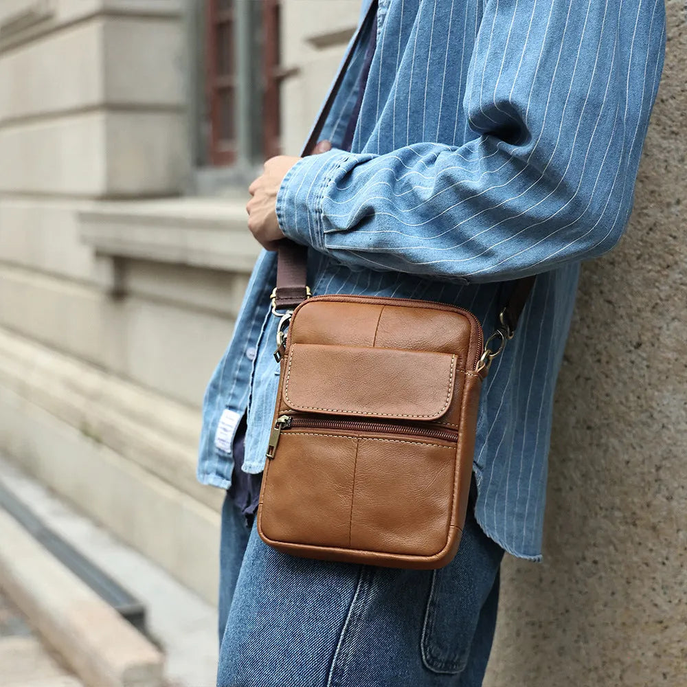 Men's brown genuine leather crossbody shoulder bag with sewing line detail.