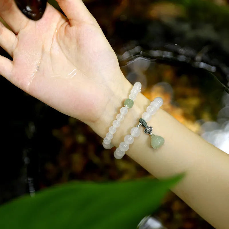 Women's S925 silver bracelet with white agate and Hetian jade stones in geometric lotus design