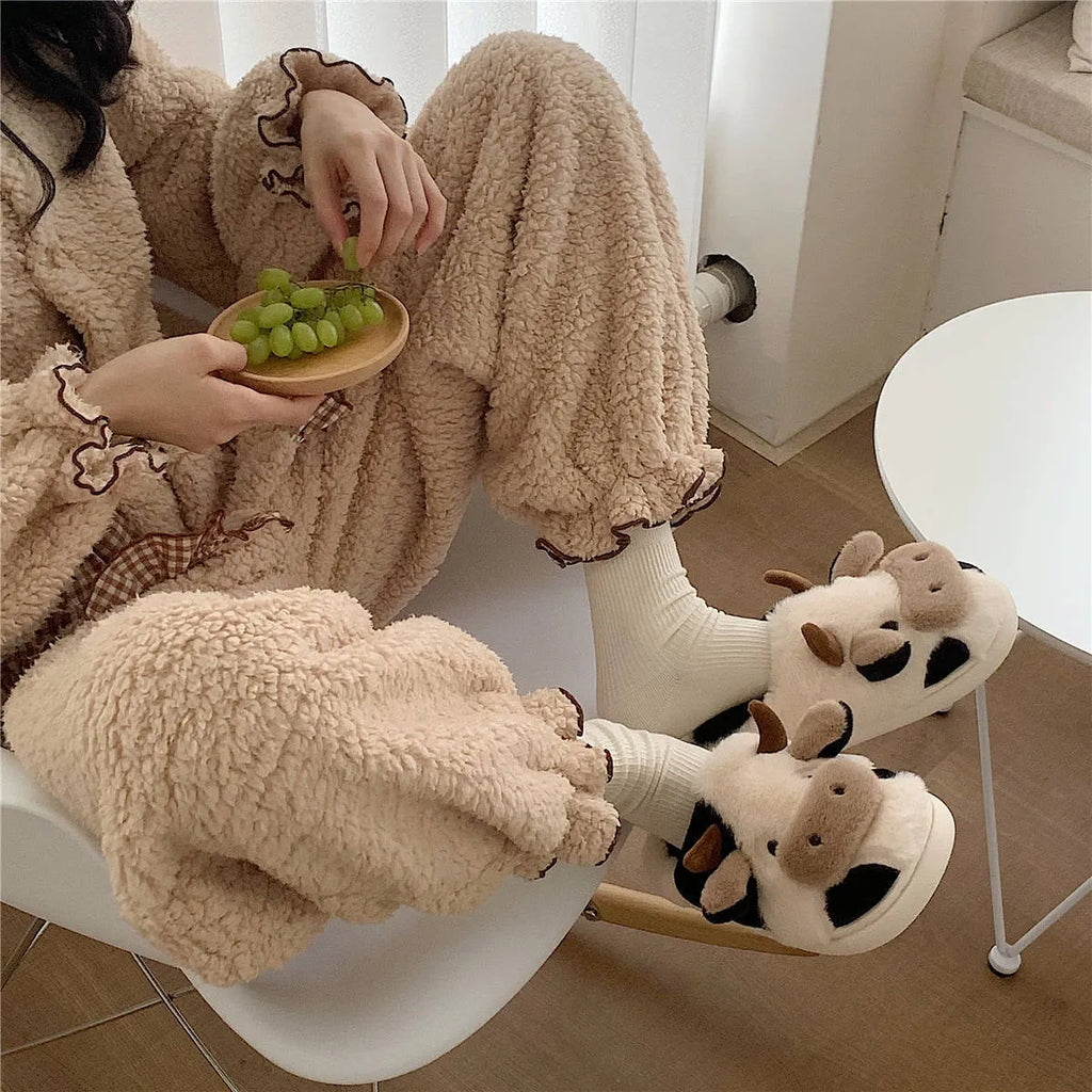White cow pattern slippers with faux fur upper and textured non-slip soles