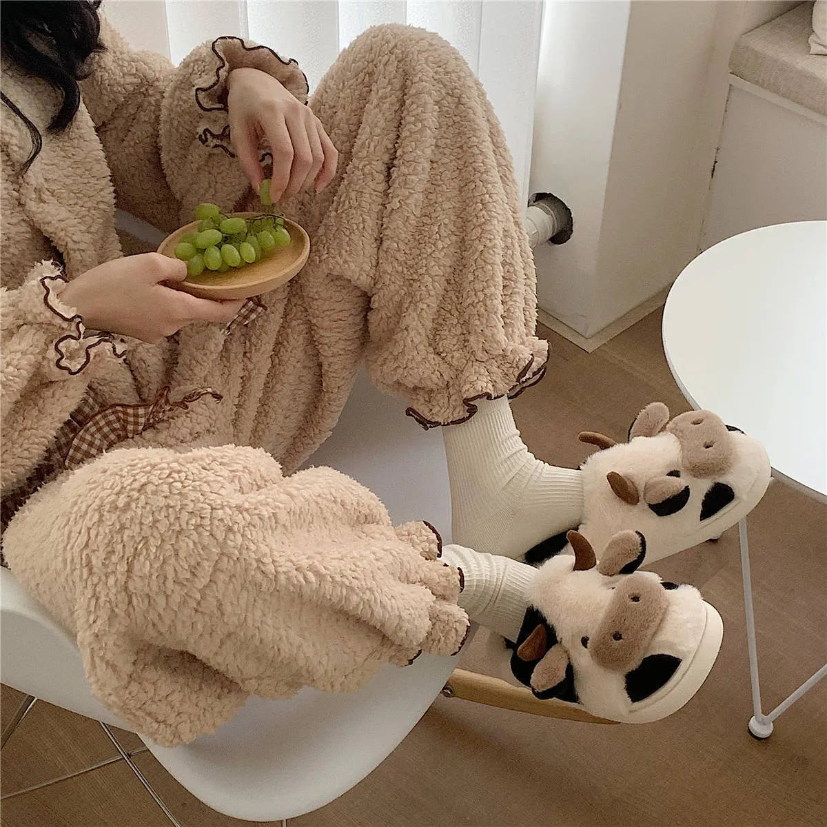 White cow pattern slippers with faux fur upper and textured non-slip soles