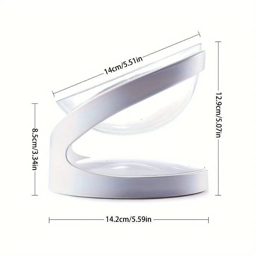 White elevated tilted plastic cat food bowl on a flat surface