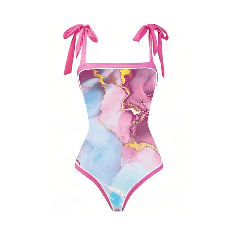 Pink one-piece printed sheath swimsuit for women with sun protection and matching skirt for beach or pool